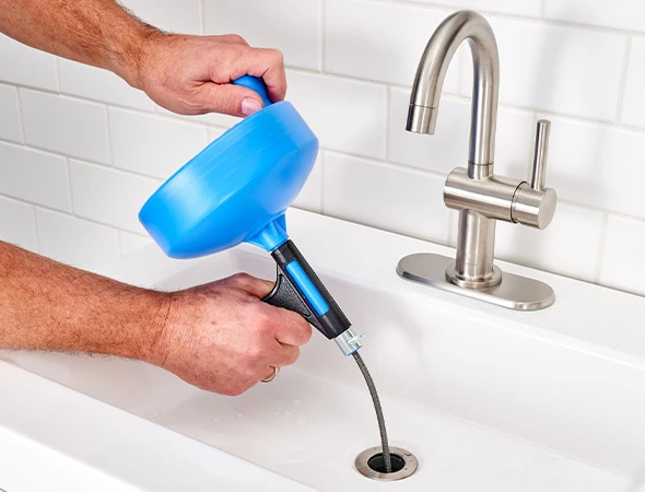 Technician performing professional drain cleaning service in Coconut Creek, FL