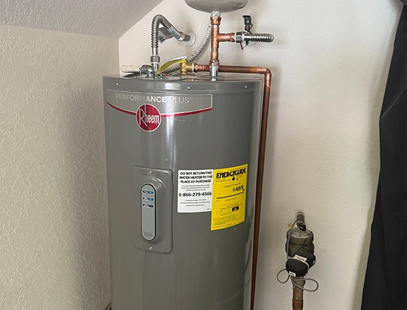 Plumber repairing a water heater to restore hot water in a Coconut Creek, FL home